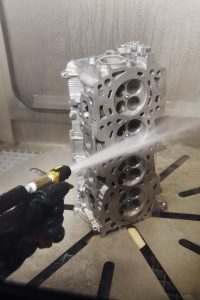 Deep Cleaning Engine Head in High Pressure Water Blast System